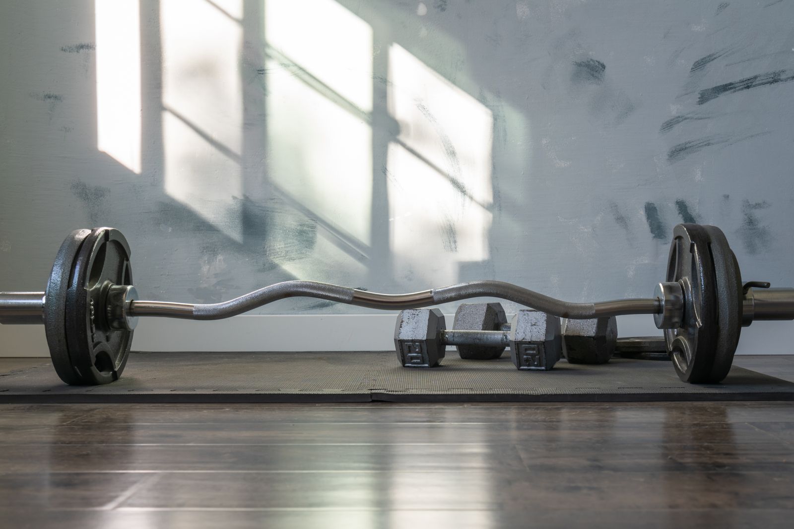 Workout equipment on a gym mat in sunlight
