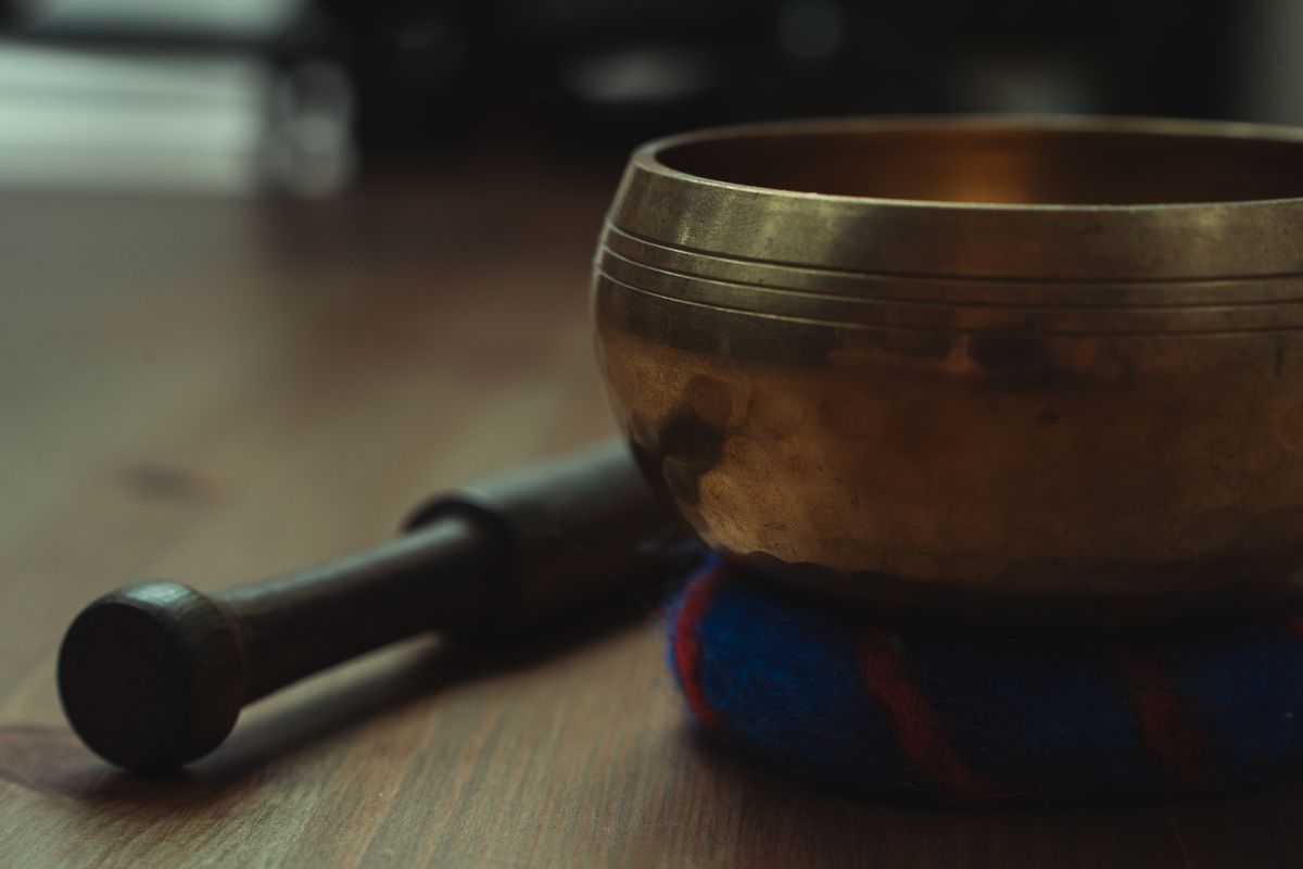 Tibetan singing bowl on a wooden table