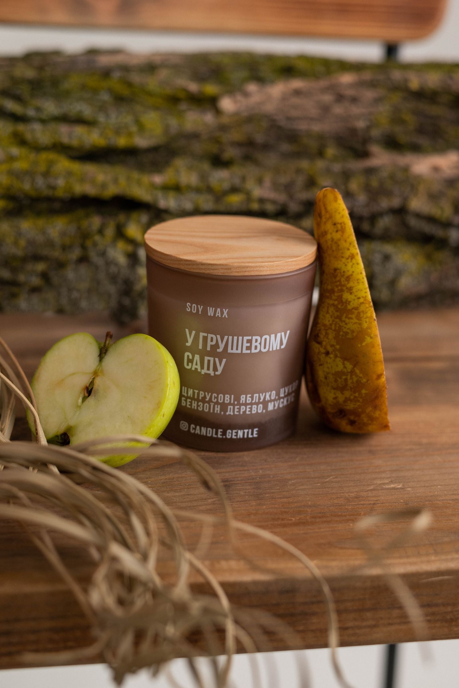 Natural soy wax candle on a rustic wooden surface