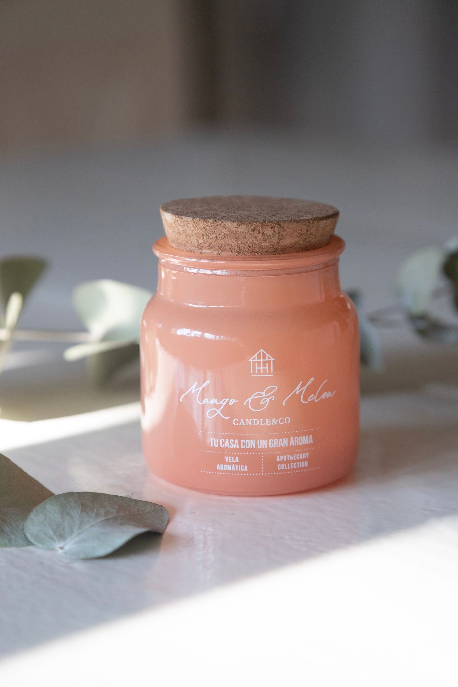 Scented candle in a cork-topped glass jar