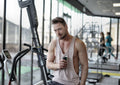 Athlete drinking a pre-workout energy drink at the gym