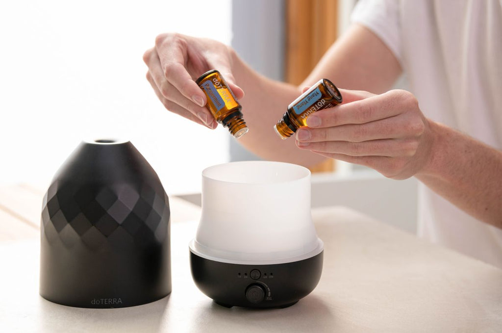 Adding essential oils to an aromatherapy diffuser at home