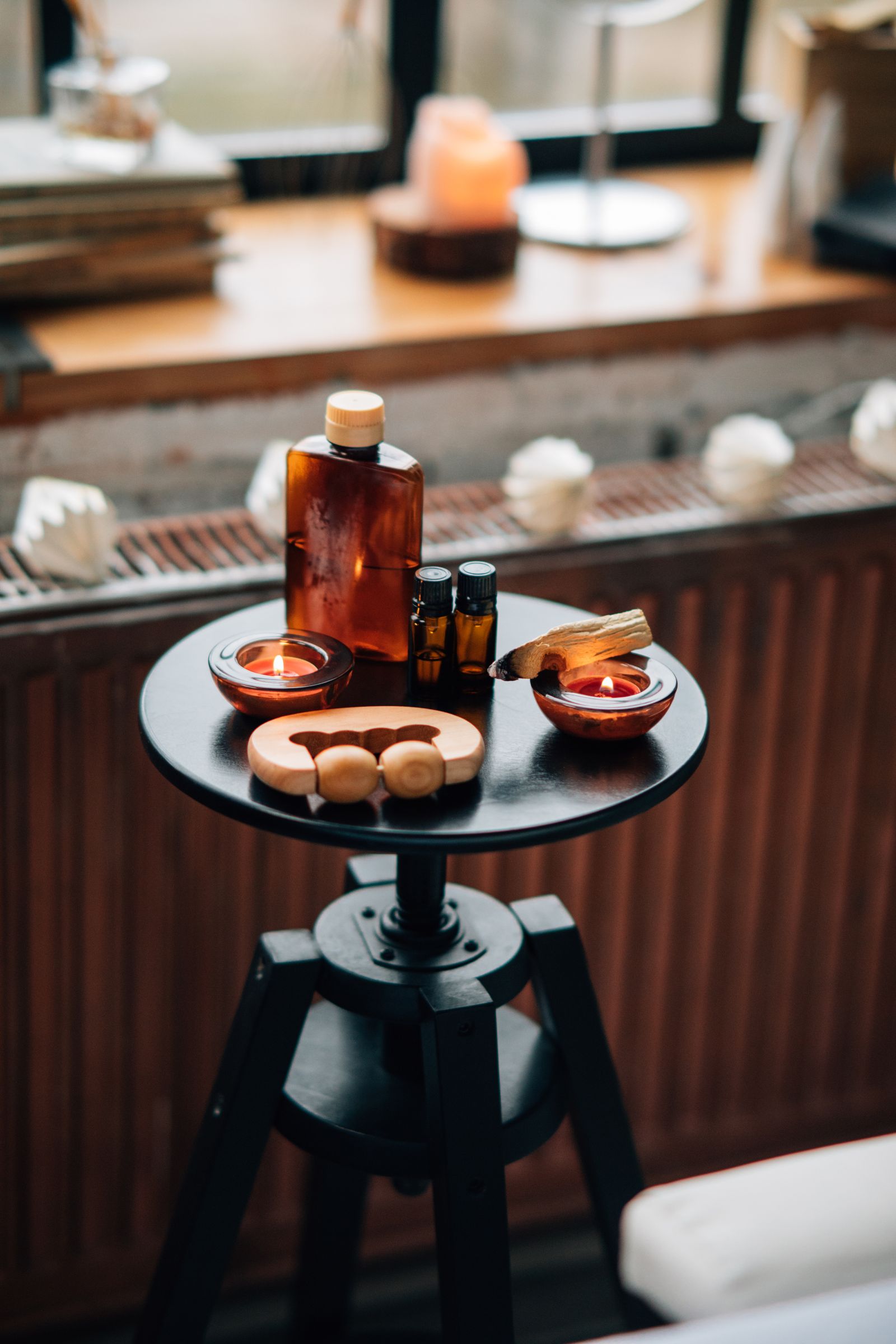 Aromatherapy oil bottles in a serene massage room