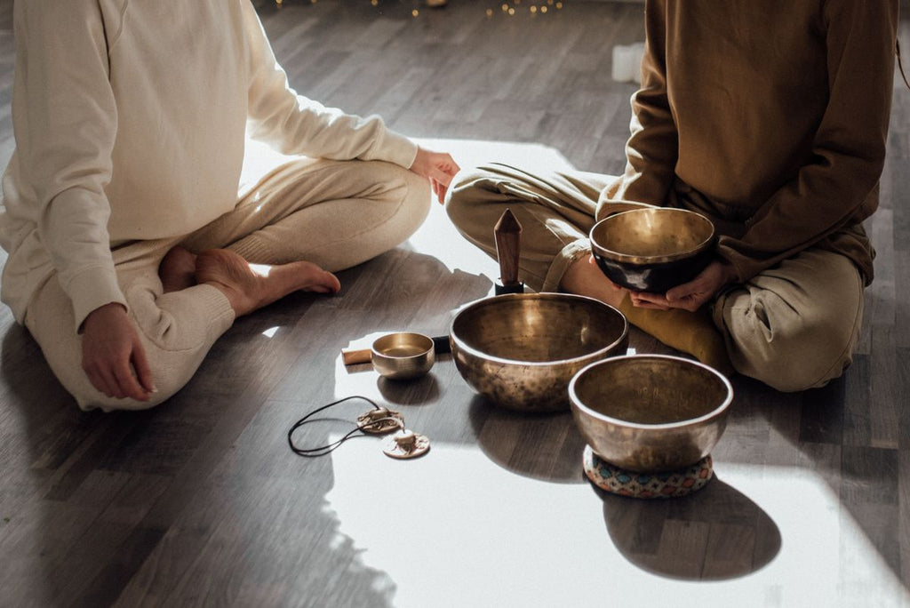 Women meditating while seated on the floor