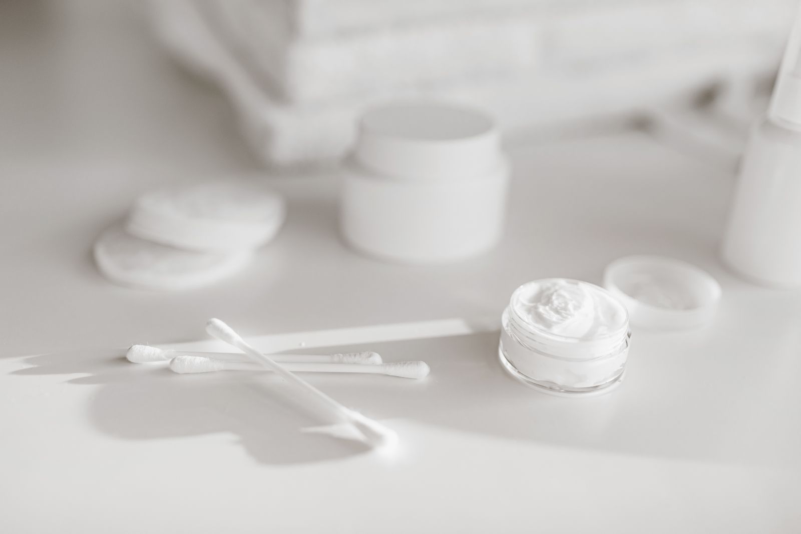 Minimalist skincare products in soft focus