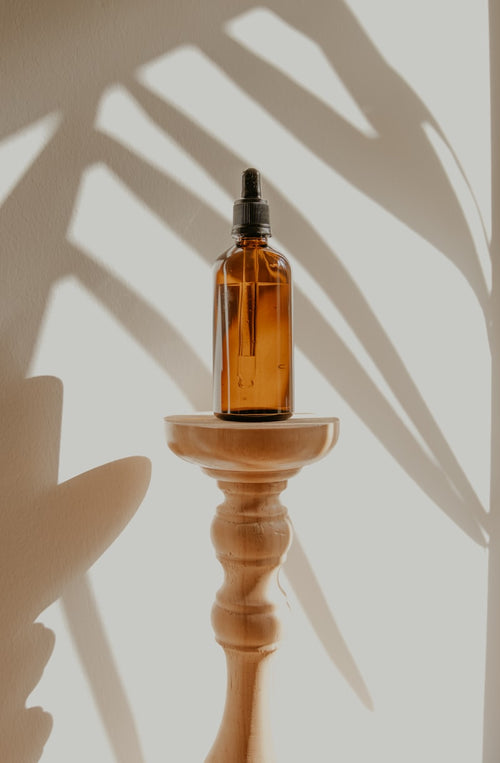 Aromatherapy essential oil diffuser on white table