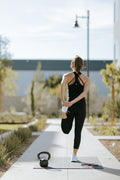 Woman exercising on premium yoga mat
