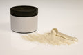 Whey protein powder jar with scoop